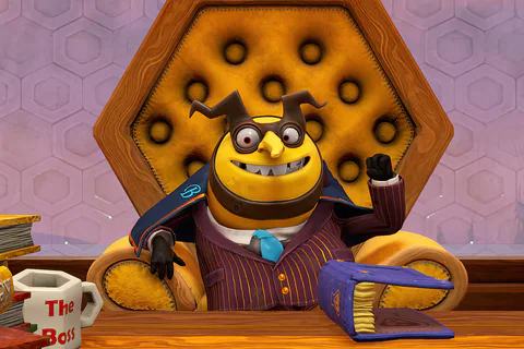 Capital B seated behind his desk in Hivory Towers.