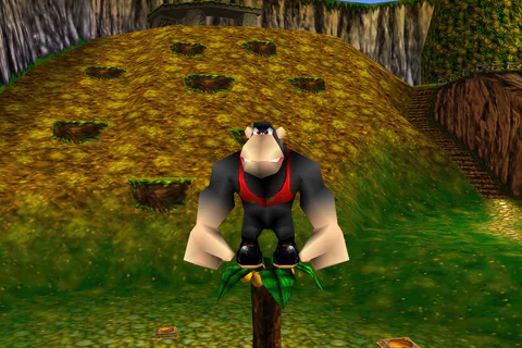 Conga’s red vest, pale hands and black shoes above the tree’s fruit