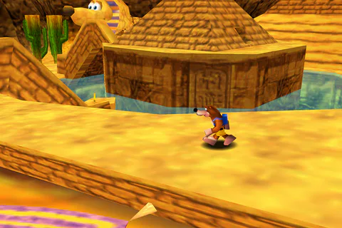 Banjo exploring the large sphinx in Gobi's Valley.