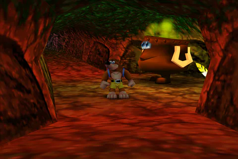 Banjo standing beside a Warp Cauldron in a red-lit lair passage.