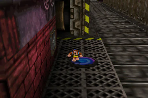 Banjo beside a blue Warp Pad on an industrial platform.