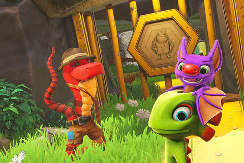 Yooka and Laylee speak to Trowzer beside a golden honeycomb-patterned door.