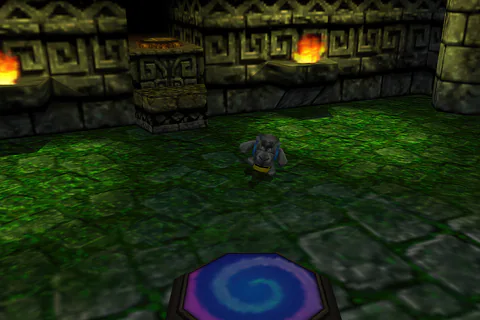 Stony Banjo stands beside the warp pad and stairs in the Mayan Kickball Stadium lobby.